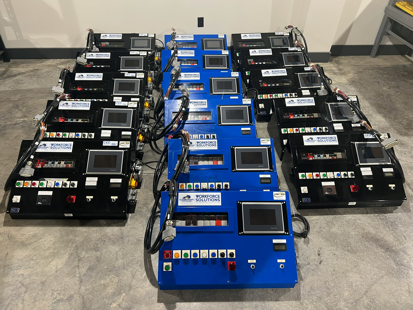 A set of PLC and HMI training panels built by Unified Automation